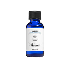 Beard oil bottle with black cap, blue glass, white label
