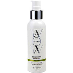 White hair repair treatment bottle with silver pump and green accent label