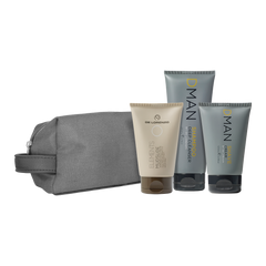 Grooming gift set with gray zip pouch and three labeled tubes of skincare