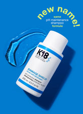 K18 Damage Shield pH protective shampoo bottle, white with blue label