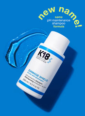 K18 Damage Shield pH protective shampoo bottle, white with blue label