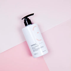 KOBO damage repair shampoo bottle with black pump and peach-accent label
