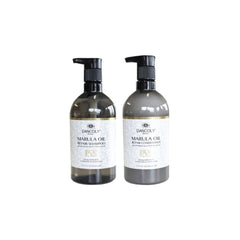 Dancoly marula oil duo: two dark glass bottles with black pumps and labeled bottles.