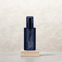 Davroe bond-building elixir bottle on stone base, dark blue glass and cap