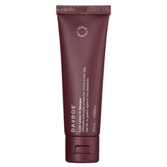 Davroe Luxe leave-in masque travel tube, dark maroon.
