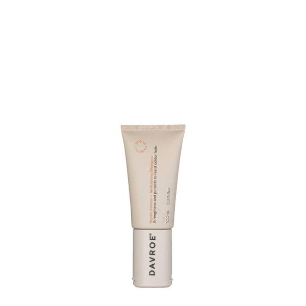 Davroe shampoo tube, beige with red label text and flip-top cap, 100 ml