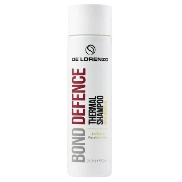 De Lorenzo Bond Defence shampoo bottle, white cylinder with black Bond Defence label