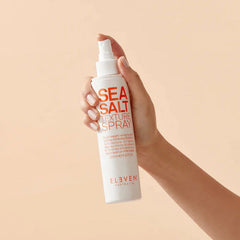 Sea Salt Texture Spray bottle held in hand, white pump, 200 ml.