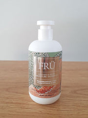 FRU shampoo bottle with white cap, coconut & vanilla repair label.