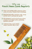 Oil-treated neem-wood fine-tooth comb, teeth facing left