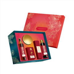Body care gift set packaging with patterned red and teal outer boxes