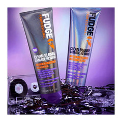 Two Fudge Clean Blonde Damage Rewind conditioner tubes with violet accents