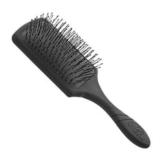 Black paddle detangling hair brush with long flexible bristles and oval grip