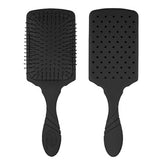 Black paddle hair brush with flexible detangling bristles and grippy handle