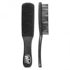 Black detangling hair brush with cushioned pad and comb teeth