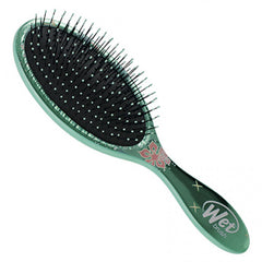 Moana wet detangling hair brush angled view, mint handle with black bristles