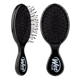 Black mini detangling hair brush with flexible bristles and Wet Brush logo