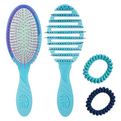 Teal detangling hair brushes with magenta bristle pads and two coiled hair ties