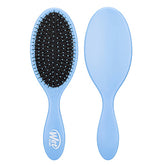 Sky blue detangling hair brush with oval pad and flexible bristles