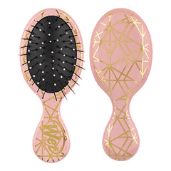 Mini detangler hair brush, peach pink with gold geometric pattern and black bristles.
