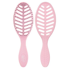 Pink oval hair brush with perforated cushion pad and textured handle