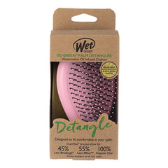 Wet Go Green palm detangler box with pink brush and bristles