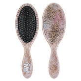 Hair detangling brush with pink speckled handle and oval black bristle pad