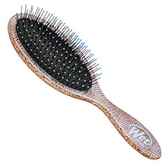 Oval hair brush cushion with black bristles and pink speckled handle