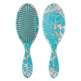 Wet brush detangler hairbrush in aqua with forest-blue marbled pattern, paddle shape