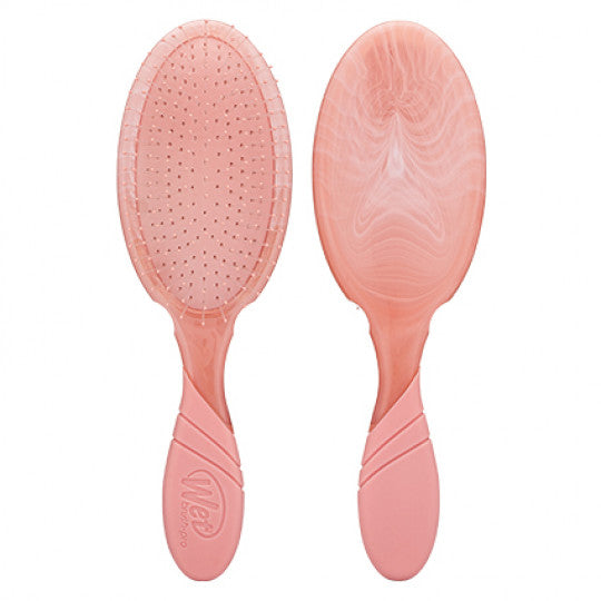 Peach tie-dye oval hair detangler brush with flexible bristle-tipped pad