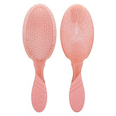 Peach tie-dye oval hair detangler brush with flexible bristle-tipped pad
