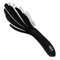Black curl detangler brush with dense flexible pins and textured grip handle