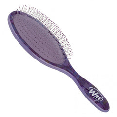 Purple oval detangling brush with clear pin bristles and grip handle