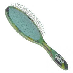Green patterned detangling hairbrush with needle-tip bristles and ergonomic handle