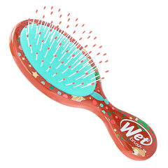 Elf-themed orange mini detangler hair brush with teal pin head