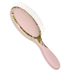 Pink oval hair brush with dotted detangling bristles and safari pattern back
