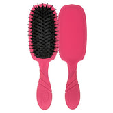 Pink hairbrush with black bristles and pink protective cover