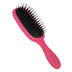Pink hairbrush with black bristles, angled for close-up view