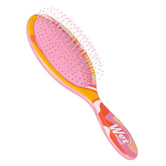 Wet Brush detangler hair brush with pink bristle pad and orange swirled handle