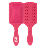 Pink paddle hair detangler brush with cushioned pad and short bristles
