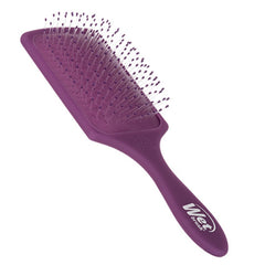 Purple paddle detangler brush with cushioned pad and dense bristles.