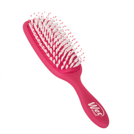 Pink Wet detangler hair brush with white bristle tips and curved paddle head