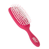 Pink Wet detangler hair brush with white bristle tips and curved paddle head