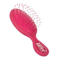 Pink mini detangling hair brush with rounded bristle head