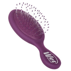Purple Wet Brush mini detangler hair brush, curved shape with soft bristle pins