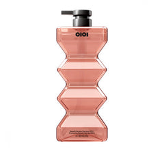 Qiqi Go Deeper cleansing shampoo bottle with black pump, pink translucent body