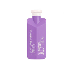 Purple biotin and ginger shampoo bottle with flip-top cap, front label visible.