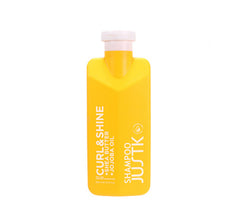 Yellow shampoo bottle with pink cap, JUSTK Curl & Shine Shea Butter & Jojoba Oil