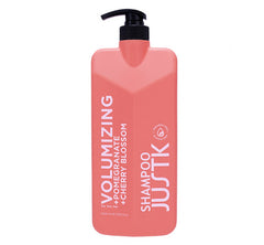 Pink volumizing shampoo bottle with black pump, pomegranate & cherry blossom scent