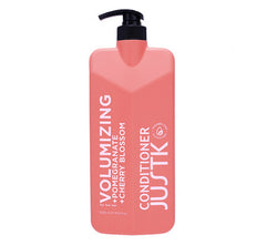 Pink volumizing conditioner bottle with black pump